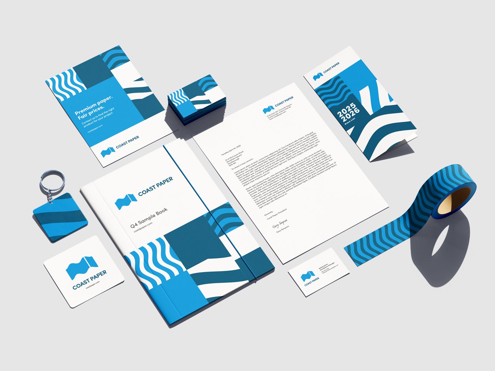 Coast Paper stationery set: folder, letterhead, business cards, price list and branded tape in two blues